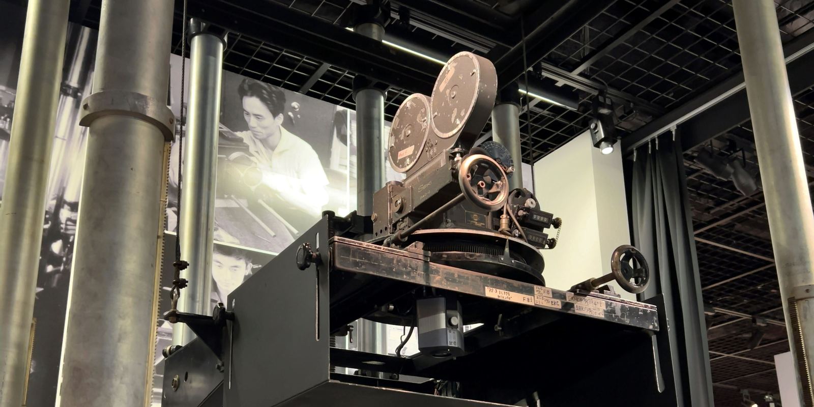 A vintage 35mm animation filming stand with a camera pointing down at a table