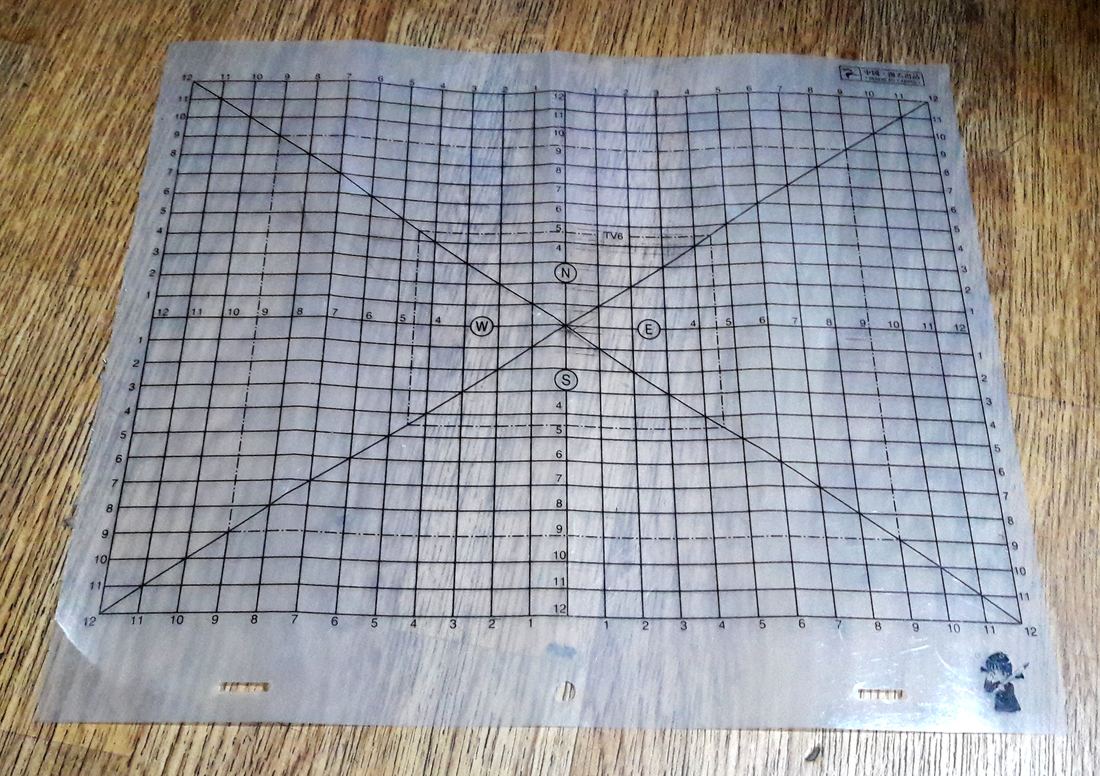 A clear animation field guide sheet with grid lines and peg holes