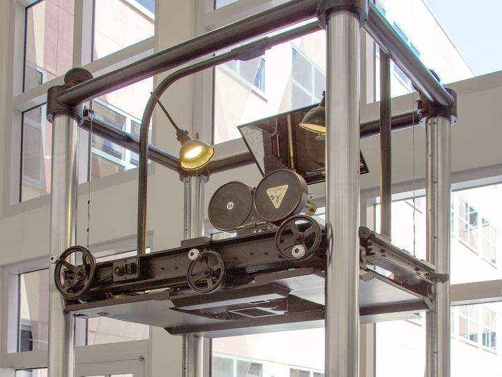 A tall Disney multiplane camera stand from 1937 on display in a museum