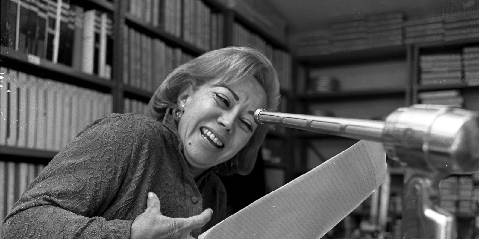 Voice actress June Foray at a microphone during an audition in 1965